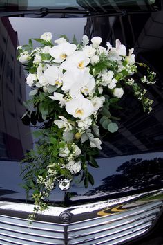 Dramatic against the Black Hood, White Orchids with other White flowers Wedding Car Deco, Wedding Getaway Car, Bridal Car, Wedding Car Decorations, Car Deco, Wedding Arrangements, White Orchids, Bride Bouquets, Wedding Deco