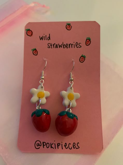 strawberry earrings made out of polymer clay by @ pokipieces on insta #polymerclay #clay #polymerclayjewelry #polymerclayearrings #strawberry #daisy #claycreations Ceramic Earrings Diy, Pink Eraser, Craft Clay, Strawberry Earrings, Clay Keychain, Clay Diy Projects, Wild Strawberries, Origami Crafts Diy, Ceramic Earring