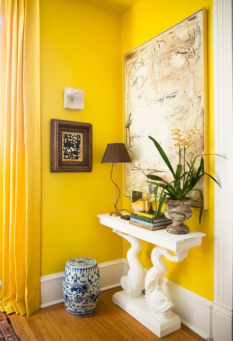 The groovy style of the '70s brought vibrant colors like yellow into our homes. Fast forward a few decades, and shades ranging from buttery yellow to rich mustard are cropping up again throughout our homes. #yellowwalls #yellowpaintcolors #paintcolortrends #accentwallcolors #bhg Colorful Powder Room, Room Curtains Ideas, Living Room Curtains Ideas, Blue Painted Walls, Dark Grey Walls, Curtains Ideas, Living Room Curtains, Yellow Colour Scheme, Red Color Schemes