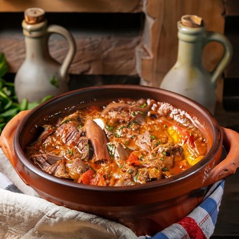 The Traditional Turkish Guvec Recipe is a beloved dish from Turkey, featuring a hearty stew cooked slowly in a clay pot to enhance the flavors of its ingredients. This dish typically includes a variety of meats and vegetables, brought together with vibrant spices and sometimes finished with cheese, making it a perfect example of Turkish comfort food. Preparation Time: 20 minutes Cooking Time: 2 hours Resting Time: 15 minutes Total Time: 2 hours 35 minutes Serving: 4 Ingredients: - 1 lb la... Turkish Pasta, Turkish Food Traditional, Building Landscape, Hearty Stew, Food Traditional, Cheese Making, Turkish Food, Hearty Stews, Turkish Recipes