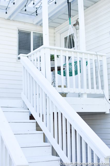 DIY-Painting a Deck white White Deck Railing Ideas, White Decks Outdoor, Painting Deck Railing, White House With Deck, White Painted Deck, White Deck Ideas, White Wood Deck, White Deck Railing, Painting A Deck