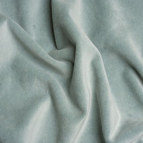 Soften your space with this pastel Banton Breeze Cotton and Polyester Upholstery Velvet. Luxe interiors begin with velvet, a textile equal in modern sophistication as comfort. The muted, light sea-blue face brings this cotton and polyester fabric down to earth, displaying a digestible color ideal for blending with other textures, colors, and design styles.  Featuring a soft face, modest luster, and supple drape, you can easily elevate your home with tufted headboards, throw pillows, and armchair Soft Fabric Texture, Tufted Headboards, Green Velvet Fabric, Elegant Bohemian, Soft Face, Velvet Couch, Blue Face, Mood Fabrics, Luxe Interiors