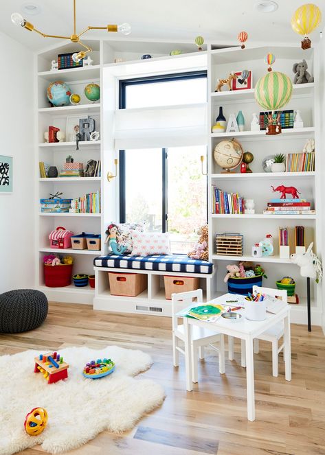 Design a space where kids can have fun and be creative with these tips for decorating a playroom. Whether you have a basement, attic, or corner of a room, these playroom design ideas deliver toy storage solutions, furniture arrangements, and fun color schemes both parents and children will love. These kids’ playroom ideas are sure to spark your inspiration. #toystorage #kidsplayroomideas #kidsroomdesign #playroom #playroomideas #bhg Playroom Vintage, Diy Bookshelves, Window Nook, Caitlin Wilson, Blogger Home, Window Size, Playroom Storage, Playroom Design, Toy Rooms