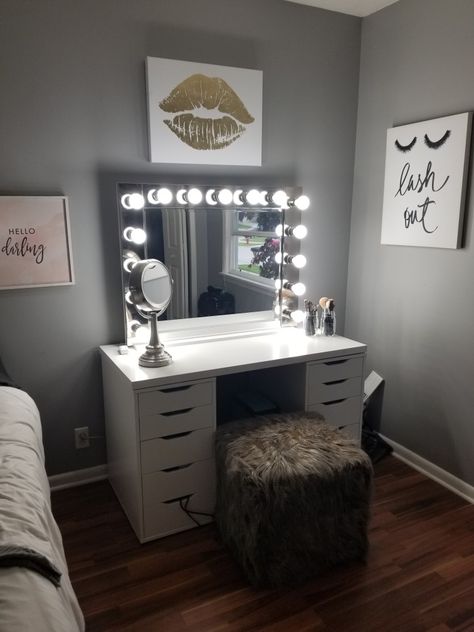 Simple make up Vanity decorations. Hobby lobby canvases / IKEA vanity / mirror & lights custom made / stool HomeGoods Vanity Set Up Ideas Bedroom, Homemade Makeup Vanity, Ikea Vanity Mirror, Vanity Set Up Ideas, Makeup Vanity Ideas Bedrooms, Bedroom Organizer, Ikea Vanity, Diy Makeup Vanity, Makeup Room Decor