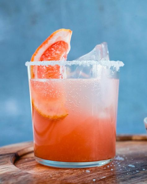 This drink has it all! The Mezcal Paloma is sweet, tangy, and smoky, pairing grapefruit and lime with just a hint of mezcal. #mezcal #paloma #mezcalpaloma #cocktail #mexican #drink Girls Night Drinks Cocktails, Paloma Recipe, Mexican Cocktails, A Couple Cooks, Paloma Cocktail, Mezcal Cocktails, Brunch Drinks, Vegetarian Cookbook, Couple Cooking