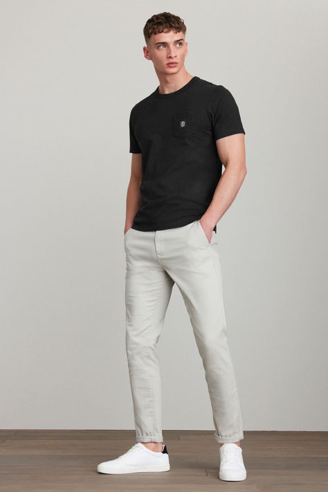 A wardrobe staple, our versatile chino trousers are made from a cotton stretch fabric for comfort and style all in one. Designed in a classic chino silhouette, they look great dressed up or down. With two functional back pockets, our variety of fits, colours, and leg lengths ensure you can find your perfect match. Also available with a modern update, our elasticated waist styles offer an adjustable fit that's right for you, and our pleat chinos offer a choice in an everyday classic. Next - Your Chinos Men Outfit, Shirt Outfit Men, Design Jersey, Outfits Hombre, Blue Chinos, Stretch Cotton Fabric, Wardrobe Classic, Stripe Outfits, Men Trousers