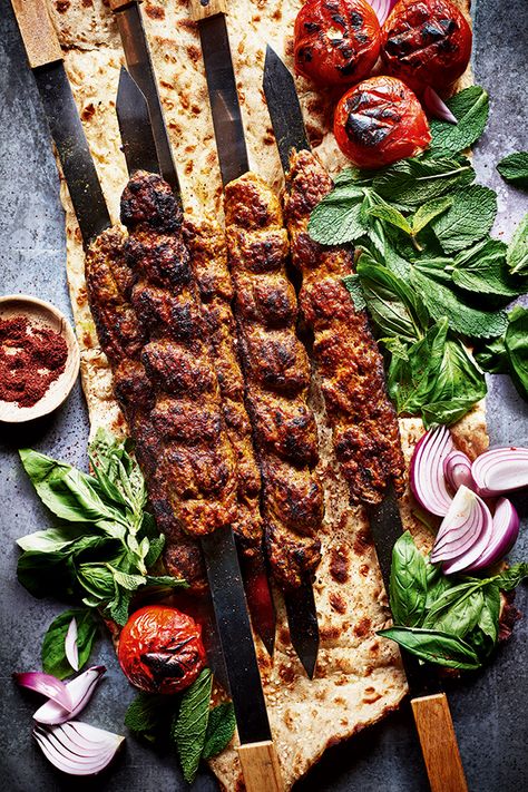 For Persians, kabab koobideh is an institution. The word ‘kebab’ (or kabab, as Persians call it) means ‘to grill’, usually over fire. The first kebabs were made by Persian soldiers who would grill meats on their swords, hence the traditional flat skewers Persians use today – you can buy them online if you want to serve them this way. Although we only have a few different varieties of kebab, for me, this is the simplest yet most delicious. Sabrina Ghayour Recipes, Persian Kebab Koobideh, Persian Food Photography, Kebab Food Photography, Iranian Food Photography, Kabab Food Photography, Persian Food Traditional, Iranian Kebab, Persian Kebab Recipe