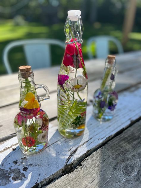 Flower preservation Flowers In Oil Bottles, Baby Oil Flower Jar, Plants In Glass Bottles, Oddity Shelf, Bathroom Window Sill, Flowers In Bottles, Wine Lifestyle, Plant In Glass, Fairy Flowers