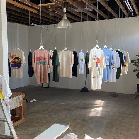 Clothing Store Pop Up, Print Shop Aesthetic, Streetwear Pop Up Shop, Fashion Brand Activation Ideas, Clothing Brand Astethic, Merch Photoshoot Ideas Studio, Pop Up Shop Aesthetic, Clothing Designer Aesthetic, Clothing Brand Office