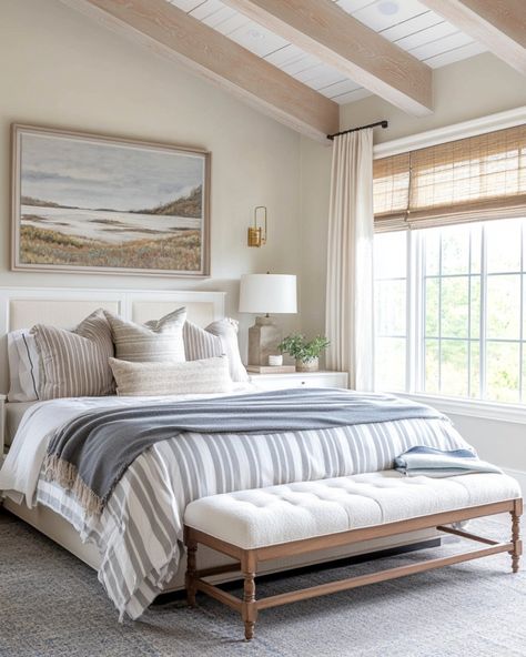 These bedroom designs are all about bringing warmth, comfort, and style together in the perfect blend. From the soft layers of bedding to the natural textures and soothing neutral tones, each space feels like a personal escape from the world. I’m loving the balance between rustic elements, like exposed wood beams, and those elegant touches, like the chandelier and cozy benches. It’s all about creating a serene space where you can truly relax and unwind. The natural light streaming in just add... Exposed Beams Bedroom, Bed Infront Of Window, Beams Bedroom, Light Airy Bedroom, Exposed Wood Beams, Neutral Bedroom Design, Layered Lighting, Coffee Table Accessories, White Wall Lights