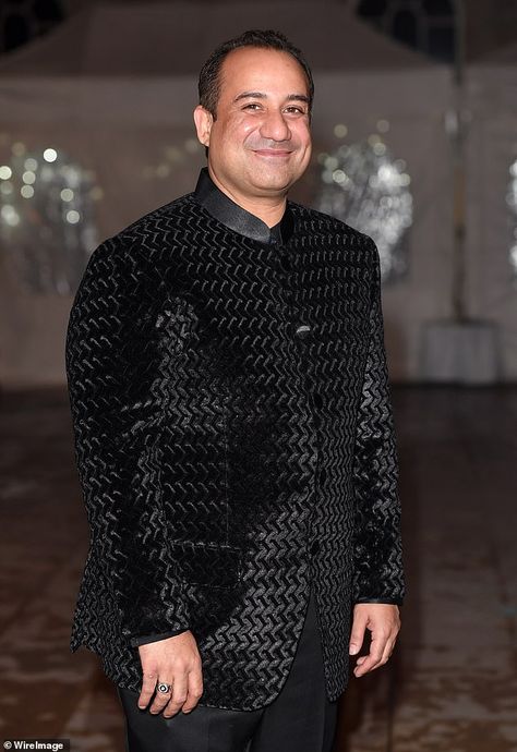 Global music star Rahat Fateh Ali Khan - who is an ambassador for anti-violence charity King Charles - was filmed in shocking video punching his bandmate and dragging him by his hair in the brutal hotel attack. Check more at https://syakaihoken-web.com/global-music-star-rahat-fateh-ali-khan-who-is-an-ambassador-for-anti-violence-charity-king-charles-was-filmed-in-shocking-video-punching-his-bandmate-and-dragging-him-by-his-hair-in-the-brutal-hot/ Black Bandhgala For Eid Designer Wear, Baul Singers Of Bengal, Saif Ali Khan Bandhgala, Saif Ali Khan Suit, Arijit Singh Live Performance, British Asian, Dead Man Walking, Mel Gibson, Latest Celebrity News