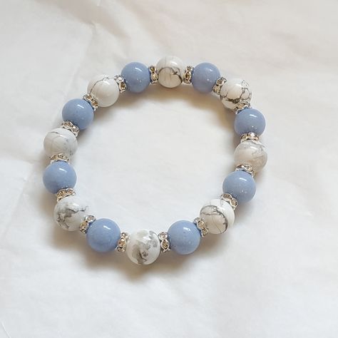 Blue Aragonite And Howlite Hand Made Genuine Stone Bracelet. The Blue Aragonite Glows In The Dark After Sun Exposure. 10mm Beads. **Ultra Durable Polyester Elastic Cord** Blue Aragonite Is A Strong Stone Of Spiritual Vision. It Will Bring More Joy And Optimism In Your Life, And It Will Provide Healing To Your Emotions. It Is A Throat Chakra Stone That Supports Communication. Howlite Can Bring Peace And Clarity Of Mind Upon Purchasing, Please Include Your Wrist Size. Pretty Beaded Bracelets, Stone Bead Bracelets, Make Clay Beads, Girly Bracelets, Blue Aragonite, Makeup Images, Bracelet Inspo, Howlite Bracelet, White Pearl Bracelet