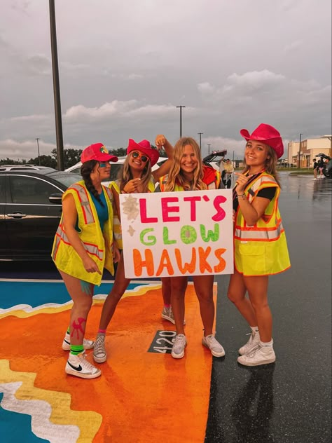 Football Game Construction Theme, Neon Themed Football Posters, Jersey Theme Football Game Poster, Paint Up Football Game Theme, Glow In The Dark Pep Rally Outfits, Neon Pep Rally Ideas, Hawiann Theme Football Games, Jail Break Football Theme, Neon Cheer Theme