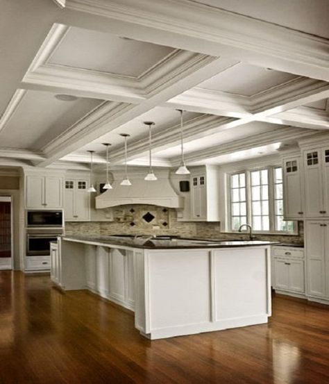 Soffits can be tricky things to deal with in a kitchen. You often can't remove them, so the question becomes how do you best cover them up or help them blend into the rest of the kitchen? Here, we've rounded up 10 ways to disguise a soffit. Coffered Ceiling Kitchen, Kitchen Soffit, Kitchen Ceiling Design, Beautiful White Kitchens, Ceiling Treatments, Kitchen Ceiling, Kitchen Design Trends, Tray Ceiling, Style Deco