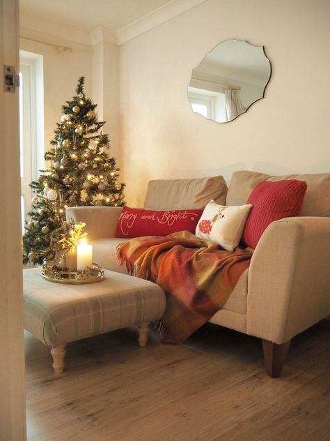 Laura Ashley Blog | How to style your sofa for Christmas | https://blog.lauraashley.com Holiday Sofa Decor, Sofa Christmas Decor, Christmas Sofa Decor, Sofa Christmas, Sofa Area, Christmas Sofa, Gold Sofa, Red Christmas Decor, Christmas Living Rooms