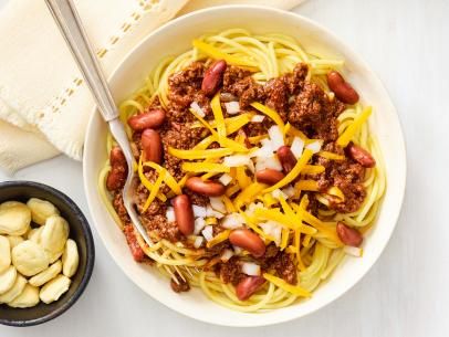 Cincinnati-Style Chili Recipe | Food Network Kitchen | Food Network Chili Recipe Food Network, Cincinnati Style Chili, Chili Food, Canning Diced Tomatoes, Chili Cook Off, Food Network Magazine, Beef Chuck, Unsweetened Chocolate, Canned Tomato Sauce