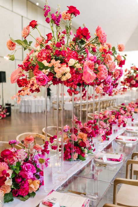 Stunning Tall Wedding Centerpieces with vibrant pink blooms | pink wedding theme, pink wedding colors, blush pink weddings, pink wedding invitations, pink and gold wedding, pink and white wedding decorations, wedding reception decor inspo, wedding tables, wedding tablescapes, wedding table decor, wedding table centerpieces, wedding flower arrangements, elegant wedding decor, pink wedding, table decorations, pink floral bridal bouquets, tall centerpieces, pink table centerpieces Tall Flower Centerpieces, Pink Wedding Table, Bright Pink Wedding, Table Centerpieces Wedding, Orange And Pink Wedding, White Wedding Decorations, Pink And White Weddings, Hot Pink Weddings, Tall Wedding Centerpieces