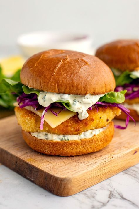 Want to learn how to make the best fish sandwich recipe? Or, as we call it in Australia, the good old fish burger. This recipe will walk you through every stage of the recipe: making the crispy fish patties, the tantalising tartar sauce, the tangy slaw and assembling it all on soft brioche buns. I got you covered with step-by-step photos, tips and variations, so you feel confident to make a dish your friends and family will be asking for again and again. Fish Burger Recipe, Fish Sandwich Recipes, Fish Patties, Pickled Red Cabbage, Red Cabbage Slaw, Recipes Fish, Fish Burger, Homemade Tartar Sauce, Fish Sandwich