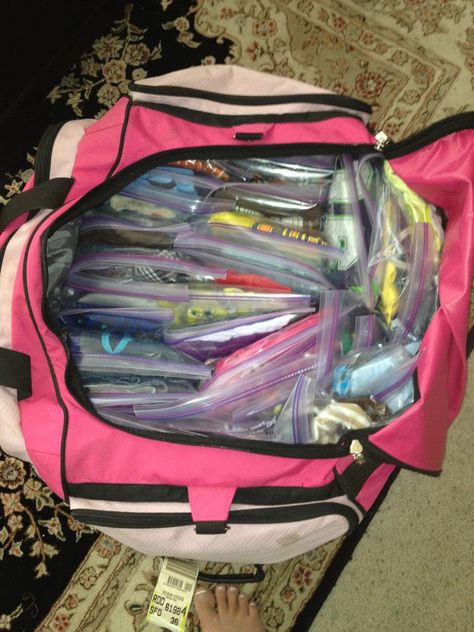 My friend packed for a road trip...She has 5 children. Each ziploc has an outfit, undies, socks and is labeled with the childs name. This is genius! In this one bag there are 46 outfits, 15 pair of PJs, 10 sweatshirts, 21 pair of undies, 40 pair of socks! She is an amazing Mama! Duffle Bag Packing Tips, Packing For A Road Trip Clothes, Ziplock Packing Travel, Kid Travel Hacks, Travel Boxes For Kids Road Trips, Roadtrip Hacks Toddler, Road Trip Packing, Vacation Packing, Road Trip With Kids