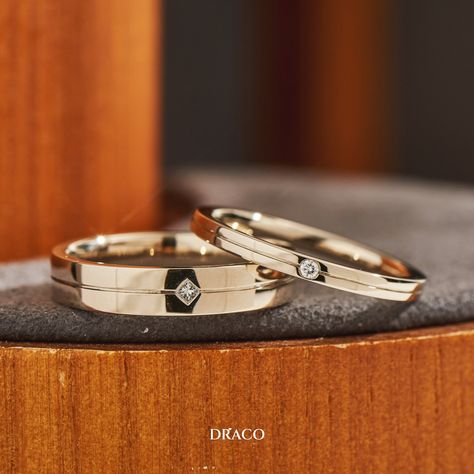 Celebrate your love with a pair of 18K champagne gold wedding bands from Draco. 

These bands are elegant and timeless, with a touch of sparkle. 

The lady’s band features a round diamond in the center, while the gentleman’s band has a square diamond.

The champagne gold is a warm and luxurious hue that suits any skin tone and style. Champagne Gold Wedding, Wedding Band With Diamonds, Men Wedding Band, Band With Diamonds, Engagement Ring Designs, Couple Ring Design, Gold Wedding Bands, Simple Lehenga, Engagement Rings Couple