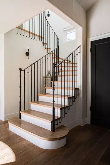 9 Black Stair Railing Ideas That Literally Go With Everything | Hunker Stair Railing Ideas, Black Stair Railing, Black Staircase, Black Railing, Stair Ideas, Coast House, Black Stairs, Traditional Staircase, Iron Stair Railing