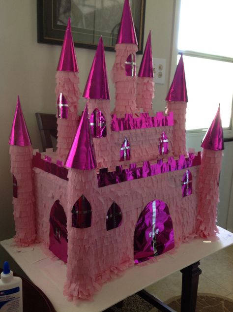 Castle princess pinata, made for my daughter birthday,expended about $10.00 , used two boxes, two swimming noddles from dollar tree, 3 rolls of crepe paper also from dollar tree, and a roll of foiled raping paper, oh an a pack of birthday hats for the roofs. Raping Paper, Castle Pinata, Princess Pinata, Pinata Ideas, Birthday Hats, Anna Birthday, Piñata Ideas, Diy Pinata, Princess Diy