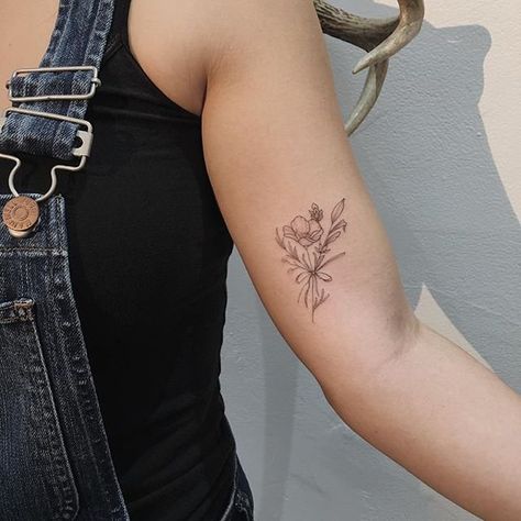 Wildflower Tattoo Ideas | POPSUGAR Beauty Wildflower Wrist Tattoo, Wildflower Tattoo Ideas, Inner Upper Arm Tattoos, Bicep Tattoo Women, Placement Tattoo, Inner Bicep Tattoo, Daffodil Tattoo, Tulip Tattoo, Inner Arm Tattoo