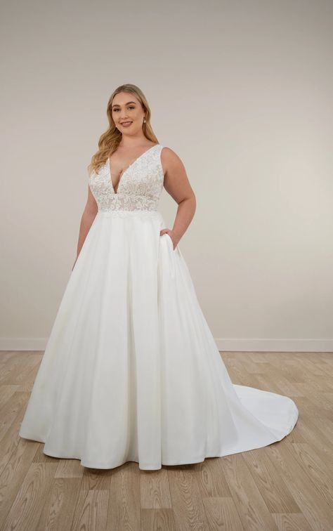 Iconic V-neck satin wedding dress, Style 7895, flaunts a flattering A-line silhouette and graphic lace bodice. Available in plus sizes for timeless romance. Timeless Wedding Dresses Plus Size, Aline Flowy Wedding Dress, V Cut Wedding Dress, Satin Ball Gown Wedding Dress, Satin Bridal Gowns, Plus Size Wedding Dress, Ballgown Wedding, Satin Ball Gown, Satin Wedding Gown