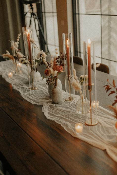 love the taper candles Burnt Orange Taper Candles, Stick Candle Centerpieces, Wedding Table With Taper Candles, Enclosed Taper Candles Wedding, Long Candles Wedding, Wedding Table Taper Candles, Taper Candles In Glass Cylinders, Long Wedding Table Flowers, Candle Stick Wedding Table Decor