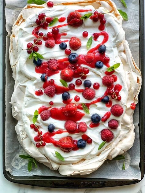 Slab Pavlova for a Crowd - Simple Bites Pavola Desserts, Sheet Pan Pavlova, Desserts For A Crowd Summer, Pavola Desserts Easy, Easy Pavlova Recipe Simple, Slab Pies For A Crowd, Pavlova Easy Recipe, Summer Desserts For A Crowd, Smores Pavlova