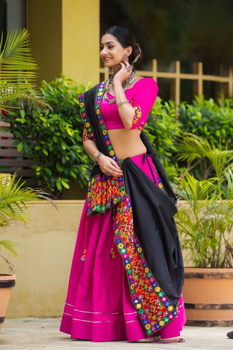 *Navratri Traditional Collection 2k24* The Elegance Of Tradition And Garba Vibes With This Plain Pink (Rani) Chaniya Choli With Gota Lace With Gamthi Lace Work Black Dupatta, Mirror Lace To Glamour Yourself As Navratri Lover *DESIGN CODE -7070 (Pink)* *Lehenga (Stitched)* Lehenga Fabric : Pure Cotton Lehenga Color : Pink (Rani) Lehenga Work : Plain With Gota Lace Work Lehenga Waist : Support Up To 42 Lehenga Closer : Drawstring , Tassels Stitching : Stitched Length : 42 Flair : *5 ... Mirror Lace, Black Dupatta, Navratri Garba, Cotton Lehenga, Mirror Work Blouse, Rani Pink, Navratri Chaniya Choli, Party Wear Gown, Lehenga Choli Online