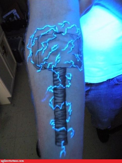 Thor's hammer with lightning in uv ink... SO COOL Uv Ink Tattoos, Thor Hammer Tattoo, Blitz Tattoo, Thor Tattoo, Hammer Tattoo, Black Light Tattoo, Lightning Tattoo, Uv Tattoo, Light Tattoo