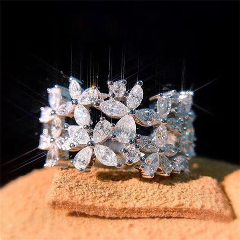 PRICES MAY VARY. 🌻 ：100% brand new imported high quality materials. 💎 ：18k gold plating process. Top quality AAA cubic zirconia stone. 🌟 ：Perfect full diamond double flower design,Shiny Gems, Exudes a Mysterious and romantic atmosphere.No woman can stop its charm . 💖 ：This ring is a beautiful and elegant cocktail ring, a perfect anniversary gift, wedding gift, mother's day gift, birthday gift, holiday gift or gift, I love you! 👍 SERVICE：If you have any questions, please contact us, we will Flower Wedding Band, Flower Diamond Ring, Stackable Wedding Bands, Silver Wedding Jewelry, Sterling Silver Wedding Band, Party Women, Flower Engagement Ring, Moissanite Diamond Rings, Silver Wedding Bands