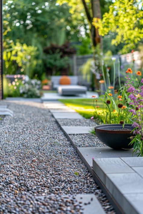 Transform your outdoor space with these creative pea gravel garden ideas. Whether you're looking for a cozy path, stylish patios, or unique border features, enjoy a stylish and low-maintenance garden that everyone loves. Use pea gravel for excellent drainage and a beautiful finish that complements any garden theme. Explore various designs that finalists agree on! Refresh your backyard with these pea gravel landscaping tips and see how effortlessly it enhances your plant beds, flowers, and seating areas. Pea Gravel Color Options, Black Pea Gravel Landscape, Pea Gravel Walkway To Front Door, Pea Gravel Landscaping, Gravel Landscaping Ideas, Gravel Garden Ideas, Pea Gravel Garden, Plant Beds, Gravel Walkway