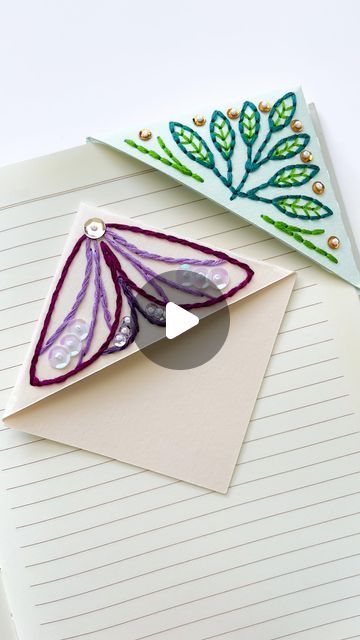 Sara Pastrana | Embroidery Artist on Instagram: "Some crackling sounds for you today 🙉 as I assemble a paper embroidery corner bookmark. I add a piece of tracing paper to the back of the embroidery so it’s able to glide on to the book pages. 

#paperembroidery #embroideryonpaper #embroiderybookmark" Book Corner Embroidery, Corner Bookmarks Paper, Embroidery Corner Bookmark, Thread Crafts, Corner Bookmark, Corner Bookmarks, Book Corners, Paper Embroidery, Tracing Paper