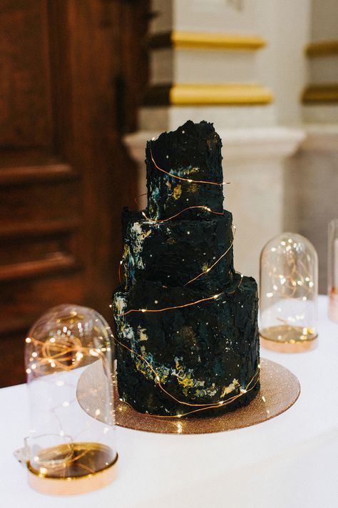 This celestial-themed cake by Cake Life Bakeshop was made to mimic the look of a dark night sky and the Milky Way and featured tiny fairy lights meant to look like stars. Lights wouldn't pop on a white cake, so if you're lighting up your dessert, consider a black exterior. Black Wedding Decorations, Wedding Cake Tops, Black Cake, Small Wedding Cakes, Black Wedding Cakes, Classic Wedding Cake, Lace Wedding Cake, Gateaux Cake, Amazing Wedding Cakes