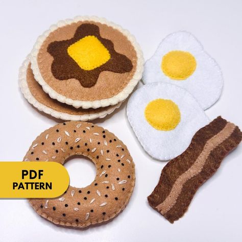 This is a PDF document that includes: A List of Materials Written Step by Step instructions Shape Templates You will learn to create Felt Breakfast Foods. Upon purchase, you will receive an instant download that can be accessed on your Desktop Computer under Purchases on the Etsy Website. Whether you are just learning or an avid sewer, this is a fun project to do year-round! Visit my TikTok page for Video Tutorial Examples https://www.tiktok.com/@annelourayne?is_from_webapp=1&sender_device=pc This tutorial is for personal use only. You may not sell products made from this pattern. Re-sale or distribution of patterns and tutorial , in any form, is strictly prohibited. Fabric Food Patterns, Felt Picnic Food, Felt Breakfast Food, Felt Bagel, Felt Crafts Patterns Templates, Felt Food Patterns Free Templates, Felt Bacon, Free Felt Patterns, Felt Pancakes