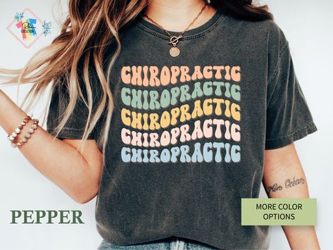 "Comfort Color Chiropractic Shirt, Chiropractic Tshirt, Chiropractic Gift, Funny Chiropractor, Future Chiropractor, Chiropractor T-shirt, Chiropractic Student, Chiropractic Office, Graduation Gift, Chiropractic School, Chiropractic Tee, Chiropractor Grad, Physical Therapist Welcome to my store. I care about your happiness and try to produce original designs for you. If you are wondering how this design looks on other products please click the following links;  Please contact me if you have a req Color Music, Glitter Images, V Neck Shirts, Nurse Shirt, Nursing Tshirts, Comfort Color, Music Teacher, Retro Halloween, Nursing Shirts