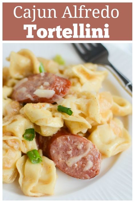 Cajun Tortellini Alfredo - delicious 20 minute weeknight dinner recipe. Tortellini and smoked sausage in a creamy cajun alfredo sauce! Italian Sausage Tortellini Alfredo, Sausage Tortellini Alfredo Recipes, Cheese Tortellini And Smoked Sausage, Keilbasa Recipes Tortellini, Tortellini And Smoked Sausage Recipes, Tortellini Kielbasa Recipes, Smoked Sausage And Tortellini Recipes, Kielbasa Alfredo Pasta, Cheese Tortellini Recipes Sausage