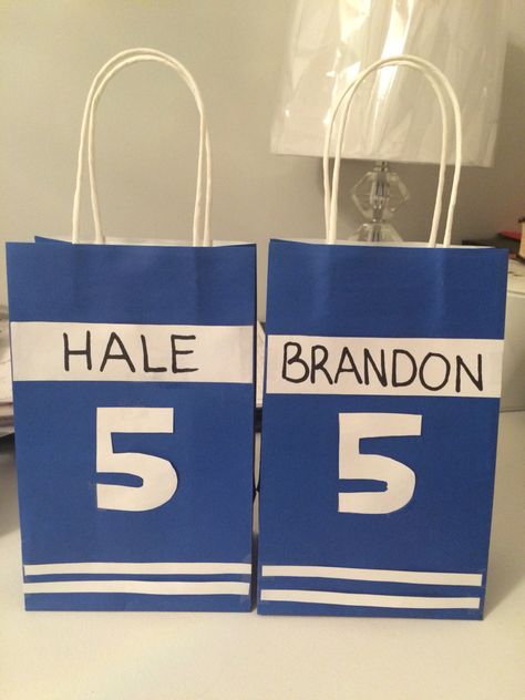 Hockey themed loot bags I made for my sons birthday party. Ice Hockey Themed Party, Hockey Themed Party Favors, Hockey Bday Party Ideas, Nhl Party Ideas, Hockey Themed Birthday Party Decorations, Hockey Loot Bag Ideas, Nhl Birthday Party Ideas, Kids Hockey Birthday Party, Hockey Birthday Party Favors