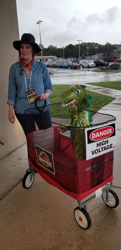 Toddler & mommy Trex Jurassic park themed costumes Mom Dinosaur Costume, Dinosaur Trainer Costume, Mom And Son Dinosaur Costumes, Jurrasic Park Wagon Costume, Jurassic Park Stroller, Jurassic Park Costume Wagon, Family Of 3 Halloween Costumes Dinosaur, Jurassic Park Halloween Wagon, Jurrasic Park Costume Women