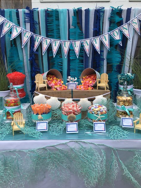 Fun beach themed candy table by the Perfect Table Cape Cod Beach Candy Bar Ideas, Beach Themed Candy Bar, Ocean Theme Graduation Party, Under The Sea Candy Table, Beachy Graduation Party, Beach Theme Graduation Party, Under The Sea Gala, Beach Graduation Party, Sleepover Board