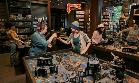 Board Game Bar Design, Board Game Shop, Card Game Room, Tabletop Game Store, Board Game Cafe Aesthetic, Boardgame Cafe Interior, Board Games Coffee Shop, Board Game Bar, Board Game Store