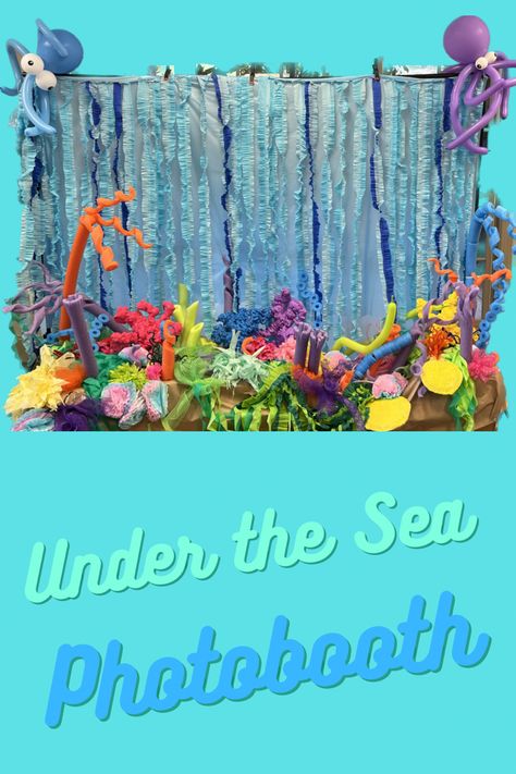 Ruffled streamers make waves on the backdrop, many different styles of faux coral make up the reef for this photo booth Under The Sea Photo Booth, Diy Coral Reef, Sea Selfie, Diy Coral, Backdrop For Pictures, Photo Backdrop Stand, Photobooth Backdrop, Under The Sea Decorations, Bubble Birthday