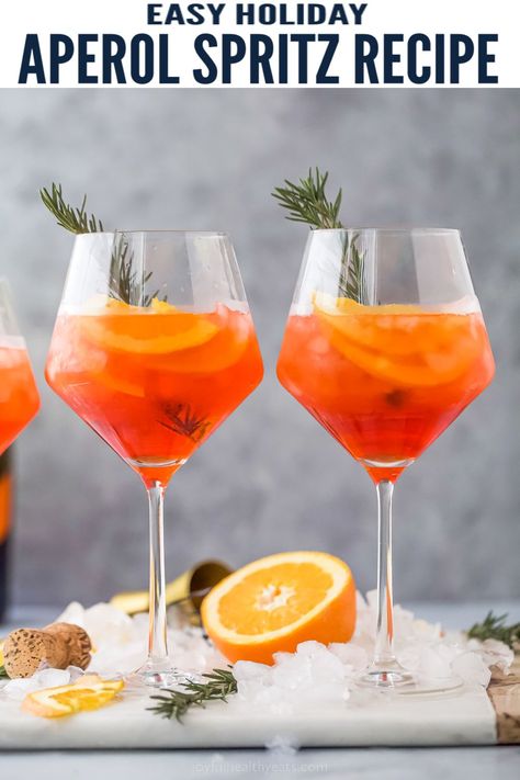 This festive Holiday Aperol Spritz is the ultimate light cocktail to enjoy during the holidays. Made with tart cranberry juice, Aperol, bubbly Prosecco, orange slice and sparkling water for the perfect refreshing sip. #holidaycocktail #holidaydrinks #cocktailrecipe #holidayparty #christmasdrinks #christmascocktails #holidayrecipes #aperolspritz Bacon Wrapped Figs, Spritz Cocktails, Aperol Spritz Recipe, Light Cocktails, Friendsgiving Food, Spritz Recipe, Cranberry Juice Cocktail, Orange Cocktails, Christmas Cocktail