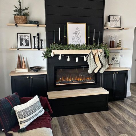 Fireplace White And Black, Black Cabinets Around Fireplace, Living Room Decor With Black Fireplace, Black Cabinets Fireplace, Black Cabinets By Fireplace, Black Fireplace With Shelves On Side, Black Fireplace Cabinets, Faux Black Fireplace, Brick Fireplace With Black Shiplap