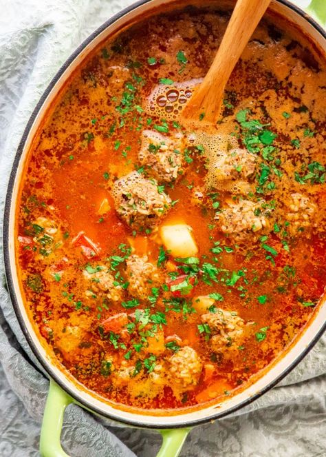 An incredible Albondigas soup which is a traditional Mexican meatball soup loaded with vegetables and full of flavor. #albondigas #soup #albondigassoup Authentic Albondigas Soup Mexican Style, Abondagus Soup, Albondiga Soup, Mexican Albondigas, Albondigas Soup Recipe Mexican, April Recipes, Albondigas Soup Recipe, Mexican Meatball Soup, Mexican Meatballs