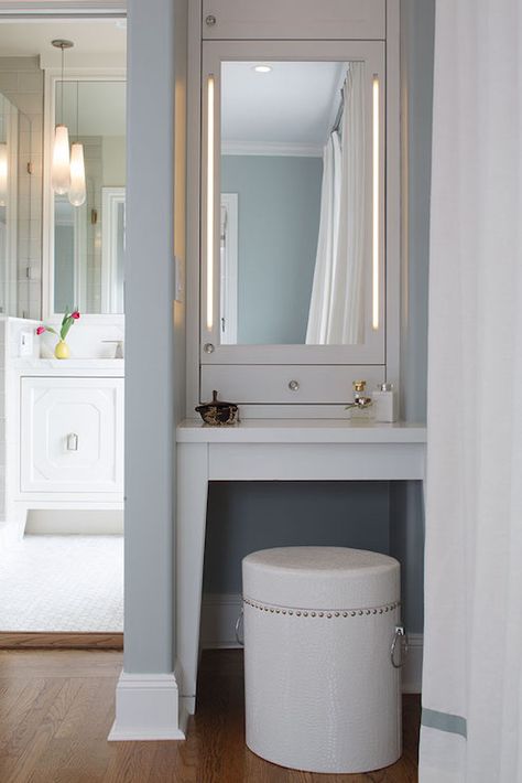 Chic dressing room features blue painted alcove filled with a built-in make up vanity paired with ... Closet With Vanity, Chic Dressing Room, Makeup Room Design, Vanity Nook, Vanity Redo, Makeup Vanity In Bathroom, Dressing Chic, Built In Vanity, Bathroom Vanity Storage