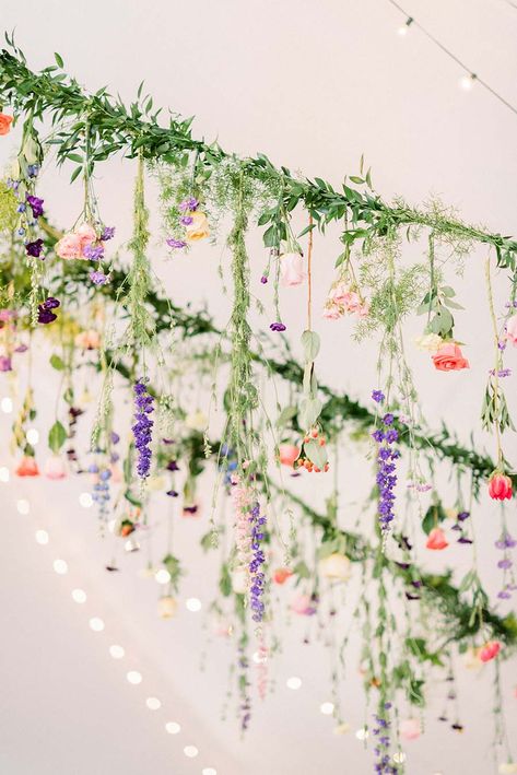 Hanging Wedding Flowers: A Whimsical Garden Wedding: Carly & Mark Greenery Garden Wedding, Hanging Flower Arch Wedding, Hanging Flowers For Wedding, Hanging Flowers From Trees, Whimsical Garden Reception, Garden Party Hanging Flowers, Garden Party Flowers Decoration, Wildflower Whimsical Wedding, Wildflower Hanging Garland