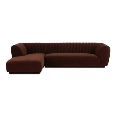 The Thambu sectional brings a tasteful touch to any room with its plush velvet upholstery, a soft touch with subtle elegance. Its vertical channel detailing along the back and arms adds a sophisticated visual texture, while the warm, neutral color allows it to blend seamlessly into any décor without overwhelming. Orren Ellis Orientation: Left Hand Facing, Body Fabric: Brown Polyester | Multi Color Sectional - Orren Ellis Thambu Sectional 27.5 H x 116.75 W x 71.0 D in red / brownPolyester | 27.5" Modular Couch, Brown Couch, Sleeper Sectional, Subtle Elegance, Row House, Visual Texture, Living Room Sectional, House Furniture, Velvet Upholstery